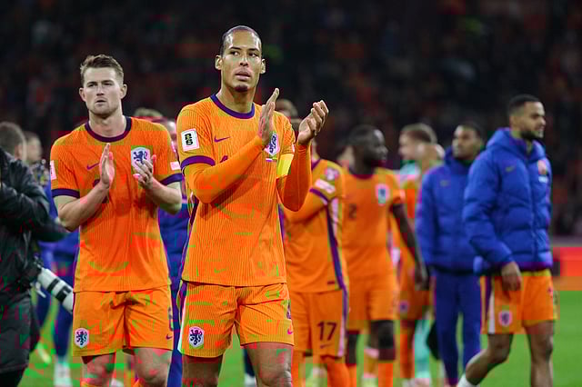 Netherlands' Virgil van Dijk, front, and teammates celebrate after a World Cup 2026 group G qualifying soccer match between Netherlands and Lithuania in Amsterdam, Netherlands, Monday, Nov. 17, 2025.