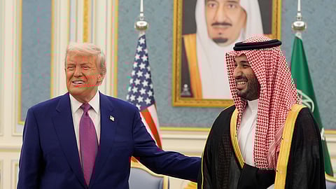 US President Donald Trump and Saudi Crown Prince Mohammed bin Salman gesture as they meet delegations at the Royal Palace in Riyadh, Saudi Arabia, May 13, 2025.