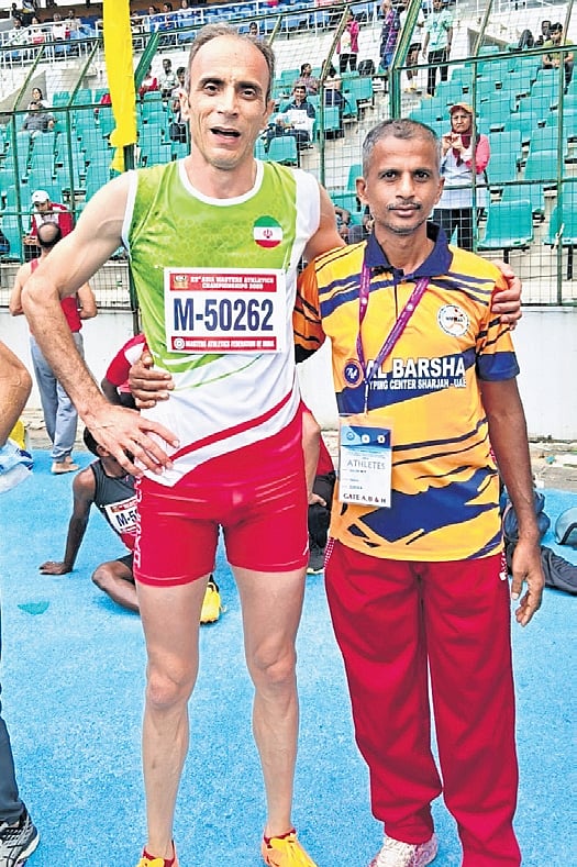 Salim with an Iranian athlete 
at the Asian Masters Meet