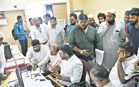 Officials verifying the he Documents and Passports of the Relatives to send them Saudi for the final rites of Deceased in Saudi accident at Haj House in Hyderabad.