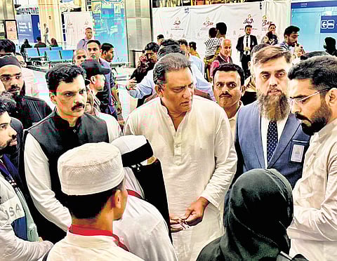 Minister for Minority Welfare and Public Enterprises Mohammed Azharuddin interacts with relatives of the deceased in Saudi Arabia on Wednesday