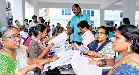 BLOs assisting voters at a SIR helpdesk at Kolathur in Chennai | P Ravikumar