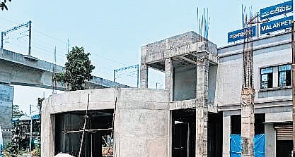 The commercial complex has had its terrace slab completed, and brickwork for the ground floor and the modified booking office on the first floor is done.