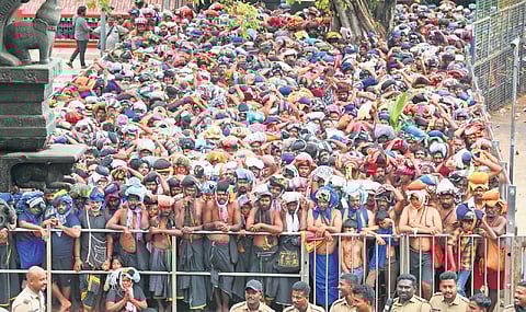People wait in front of the lower ‘thirumuttam’ for darshan at Sabarimala temple on Thursday.