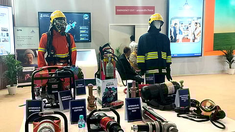 Mannequins adorned in airport fire rescue gear.