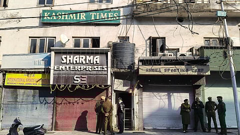 Officials outside the Kashmir Times office during a raid by State Investigation Agency (SIA) as part of an ongoing probe into a terror module case, in Jammu, on November 20, 2025.