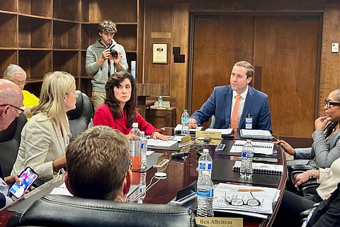 John Wahl, chairman of the Alabama Public Library Service Board of Directors, center right, listens during a meeting in Montgomery, Ala., Thursday, Nov. 20, 2025.