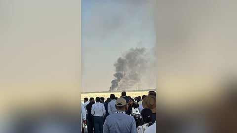 Black smoke rose over the Al Maktoum International Airport as the crowd of spectators witnessed the crash.