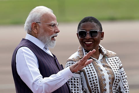 Indian Prime Minister Narendra Modi is welcomed by Khumbudzo Ntshavheni, Minister in the Presidency, on his arrival in South Africa for the G20 Summit. (Photo | PTI)