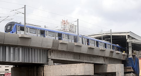 Chennai Metro train stationed at the CMRL station near Porur junction.
