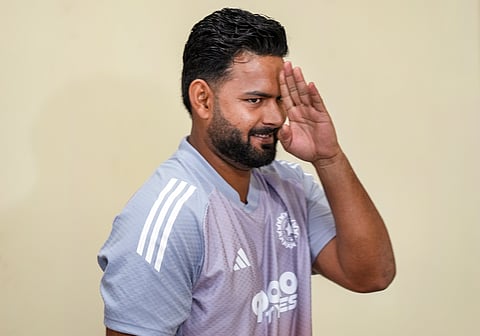 Kuldeep Yadav celebrates a wicket with his teammates
