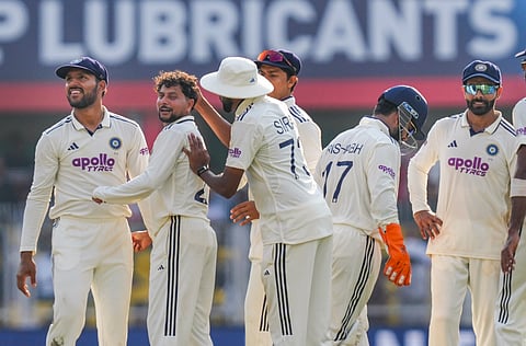 Kuldeep Yadav celebrates a wicket with his teammates