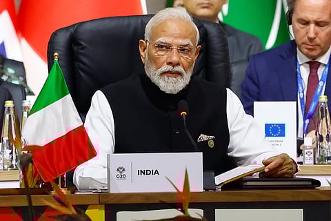 Prime Minister Narendra Modi attends a plenary session on the opening day of the G20 Summit at the Nasrec Expo Centre, in Johannesburg, South Africa, Saturday, Nov. 22, 2025.