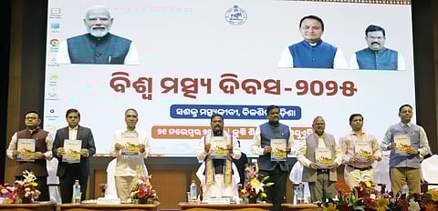 Minister of Fisheries Gokula Nanda Mallik releasing souvenir on the World Fisheries Day celebration in Bhubaneswar on Friday 