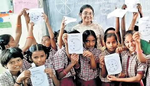 Ashrita with students at one of her workshops in a government school.