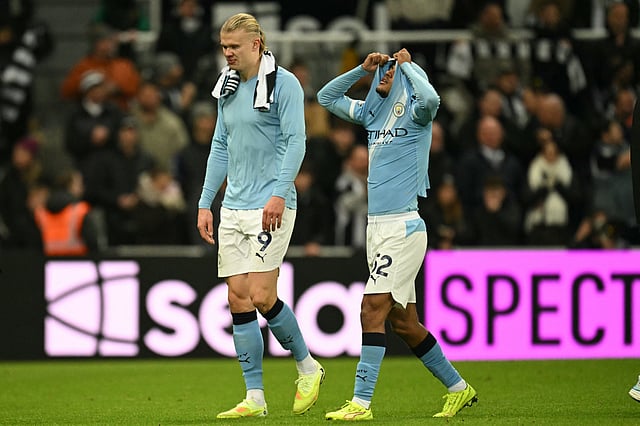 Manchester City's Norwegian striker #09 Erling Haaland (L) and Manchester City's Norwegian midfielder #52 Oscar Bobb (R) react to their defeat after the English Premier League football match between Newcastle United and Manchester City at St James' Park in Newcastle-upon-Tyne, north east England on November 22, 2025.