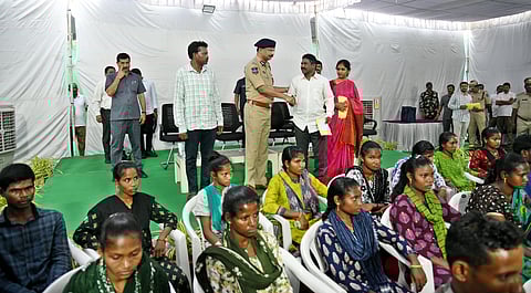 Maoist Azad Receiving Rs 20-Lakhs Cheque from DGP Shivadhar Reddy.