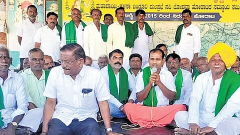 Karnataka Raita Sena leader Veeresh Sobaradmath with farmers at the protest site in Naragund, Gadag district, on Saturday.