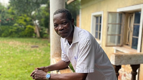 Moses Kutoi, a clan leader of the Bagisu people in eastern Uganda, stands on the balcony of his house in Nabumali, Mbale, Uganda, Wednesday, Nov. 19, 2025.