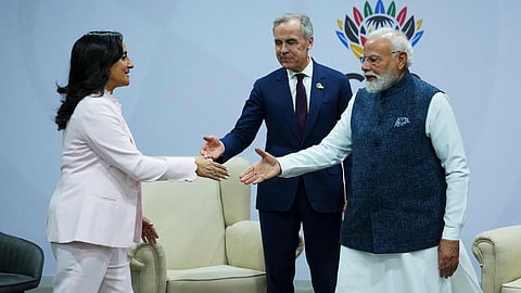 Canada's Prime Minister Mark Carney, middle, introduces Minister of Foreign Affairs Anita Anand, left, during a bilateral meeting with Indian Prime Minister Narendra Modi during the G20 Summit, in Johannesburg, Sunday, Nov. 23, 2025. 