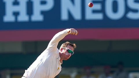 South Africa's Simon Harmer bowls a delivery during the fifth day of the second Test cricket match between India and South Africa, at ACA Stadium, Barsapara in Guwahati, Wednesday, Nov. 26, 2025.