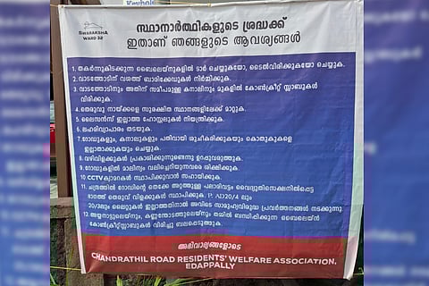 The banner put up by the residents of Chandrathil Road at Edappally