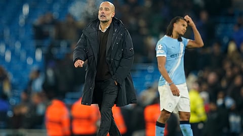 Manchester City's head coach Pep Guardiola walks on the pitch after the end of the Champions League opening phase soccer match between Manchester City and Bayer Leverkusen in Manchester, England, Tuesday, Nov. 25, 2025.