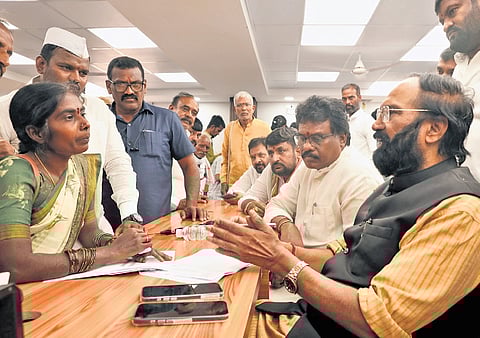 Irrigation Minister N Uttam Kumar Reddy speaks to a woman during the ‘Meet Your Minister’ programme at Gandhi Bhavan in Hyderabad on Thursday 