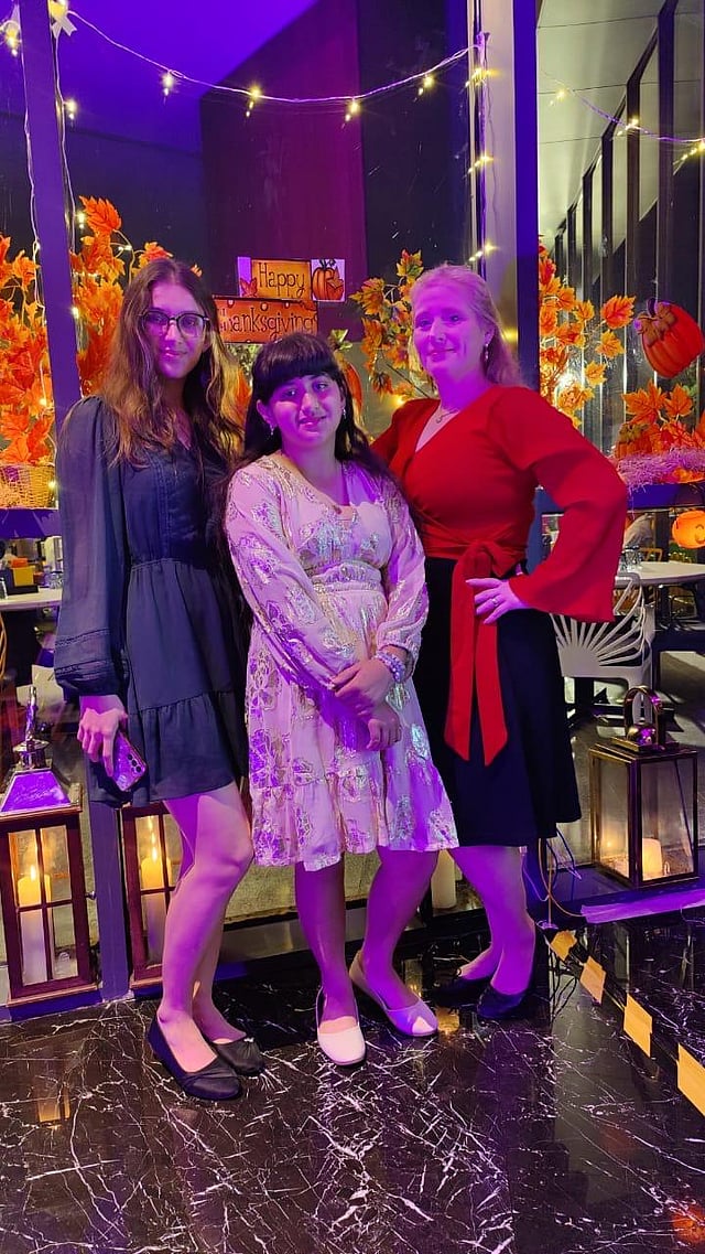 Dawn Hinke with her daughters at a Thanksgiving party 