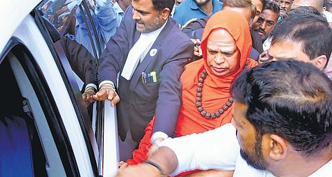 Dr Shivamurthy Murugha Sharanaru, head of the Murugha Mutt, walks out of the Chitradurga court after the judgment.