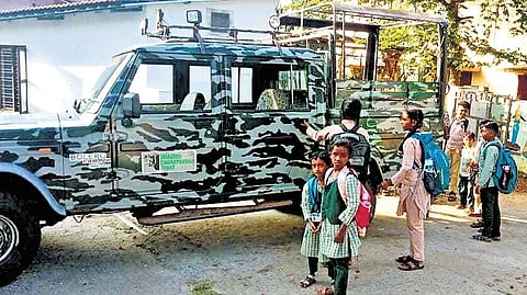 Kids from the tribal settlement are transported to the Mavanallah High School in a forest department vehicle in the morning and evening.