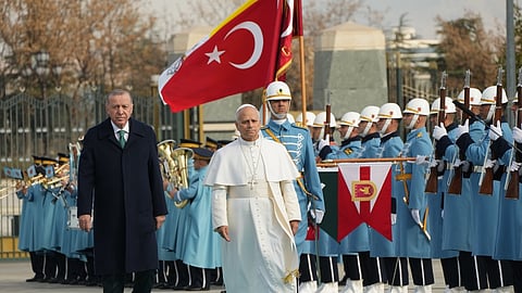 Pope Leo XIV is flanked by Turkish President Recep Tayyip Erdogan as he arrives at the Presidential Palace in Ankara, Turkey, Thursday, Nov. 27, 2025.