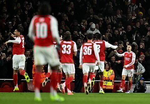 Arsenal's Gabriel Martinelli (R) celebrates scoring his team's third goal during the UEFA Champions League league phase football match between Arsenal and Bayern Munich on November 26, 2025.