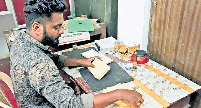 Postman Vishnu  engaged in work at the Sabarimala post office