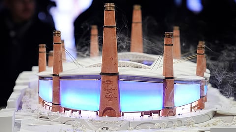 Pepole look at a diorama of Birmingham City Football Club's new stadium plans during the unveiling in Birmingham, England, Thursday, Nov. 20, 2025.