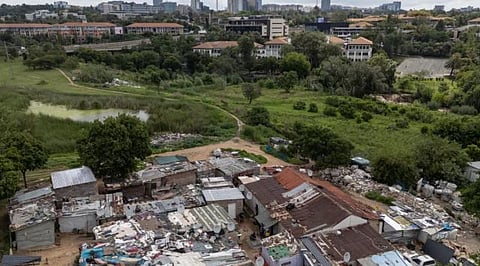 The backdrop of skyscrapers and shiny office towers is a stark reminder of the gulf separating two worlds in South Africa, which the World Bank ranks as the most unequal country in the world.
