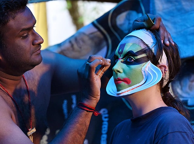 Giulia being readied as Krishna by her guru Sadanam Vishnu Prasad.