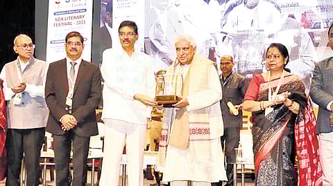 Governor Hari Babu Kambhampati presenting SOA Sahitya Samman to lyricist, poet and scriptwriter Javed Akhtar in Bhubaneswar on Saturday.