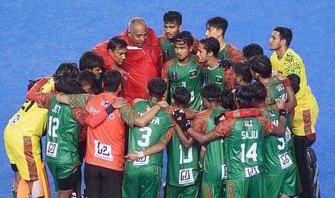 Bangladesh junior hockey team in a huddle at the Junior World Cup on Saturday