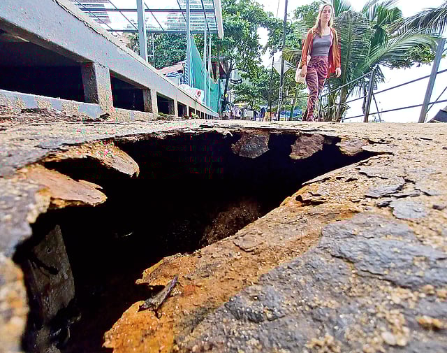 This crater on the bridge leading to the Papanasam beach screams out the state of affairs here.