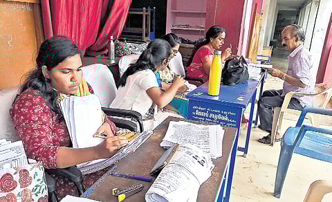 Booth Level Officers at a help desk organised as part of the one-day special SIR camp  in Chennai on Saturday 