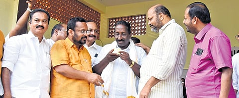Law Minister P Rajeeve and Revenue Minister K Rajan offer lemon juice to a protest leader as the Munambam Land Protest Committee announced temporary halt to the 414-day agitation demanding the restoration of revenue rights