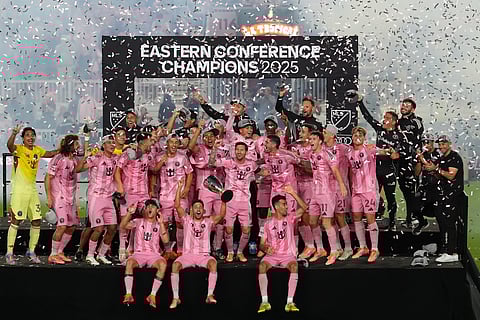 Inter Miami players and team staff pose for a picture as they celebrate winning an MLS Eastern Conference final soccer match, Saturday, Nov. 29, 2025, in Fort Lauderdale, Fla.