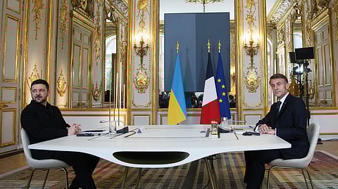 French President Emmanuel Macron, right, and Ukrainian President Volodymyr Zelenskyy pose prior to a meeting, Monday, Dec. 1, 2025, at the Elysee Palace in Paris. 