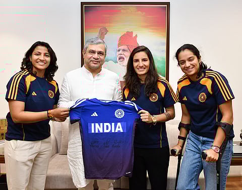 The three players with Railway Minister Ashwini Vaishnaw.