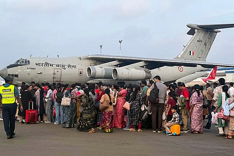 In this image posted on Nov. 30, 2025, Indian nationals stranded in cyclone-hit Sri Lanka being evacuated by the Indian Air Force