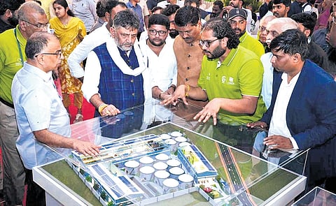 Deputy Chief Minister DK Shivakumar inspects a scale model of the integrated solid waste segregation unit at Kannahalli on Magadi Main Road on Monday 