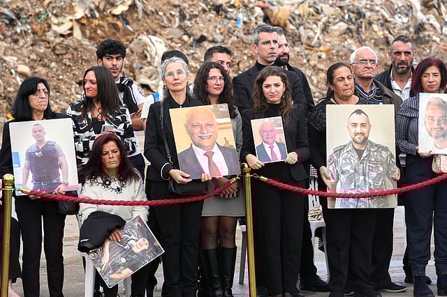 Relatives of victims of the 2020 Beirut port explosion wait for the arrival of Pope Leo XIV at the site of the explosion in Beirut, Lebanon, Tuesday, Dec. 2, 2025.