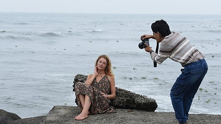A tourist during a photo session along the Fort Kochi waterfront
