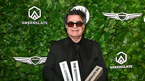 Jafar Panahi poses with the awards for best international feature, best original screenplay and best director at The Gotham Film Awards  at Cipriani Wall Streeton Monday, Dec 1, 2025, in New York. 